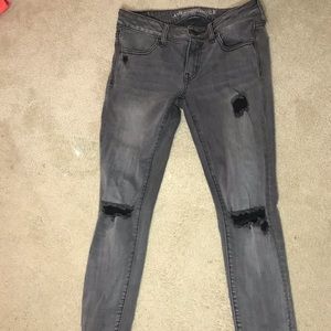 Lightly distressed black jeans